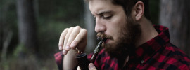 Guy lighting a pipe