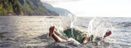 Person splashing down into a lake.