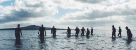 People wading into the ocean.